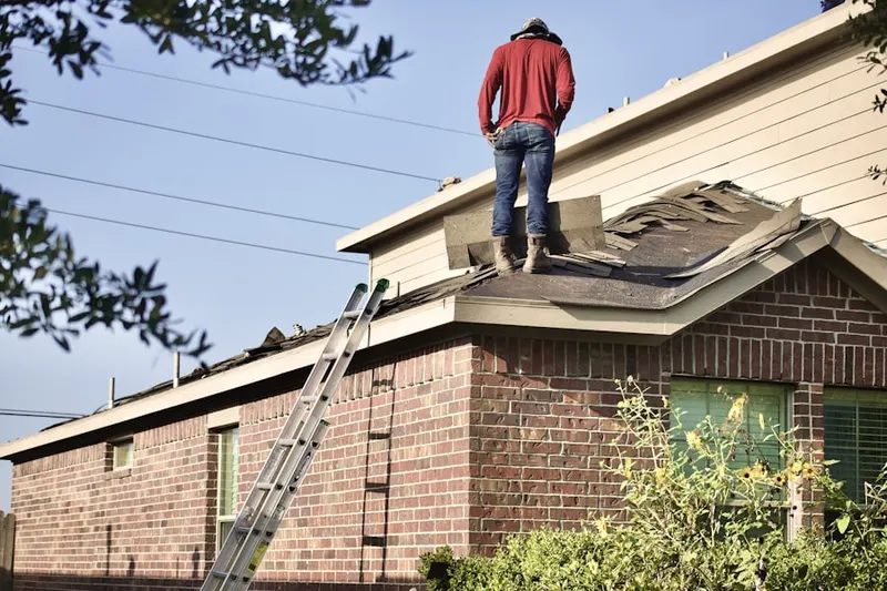 Professional roofer working on a residential roof in Feather Sound